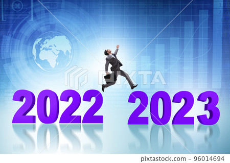 Businessman jumping from the year 2022 to 2023 Businessman jumping from the year 2022 to 2023 96014694