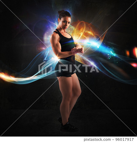 Energy of muscular woman Energy of muscular woman 96017917