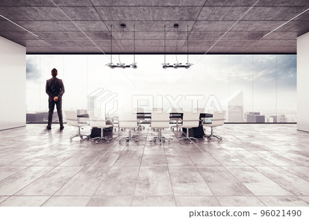 Successful businessman in a meeting room Successful businessman in a meeting room 96021490
