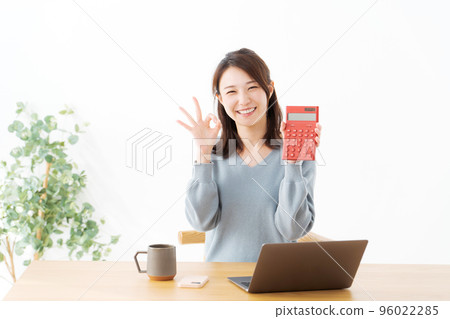 Woman with a calculator Woman with a calculator 96022285