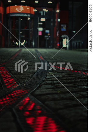 Red luminous rails on the forecourt in front of a headquarter in Bochum, Germany. Red luminous rails on the forecourt in front of a headquarter in Bochum, Germany. 96024196