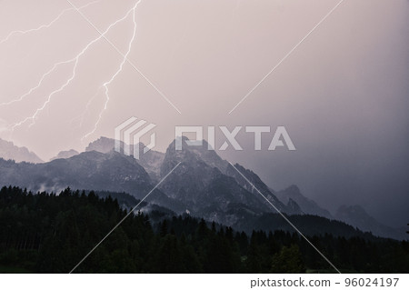 Dramatic lightning strike during a thunderstorm in the Steinberg in Leogang, Salzburg, Austria 96024197