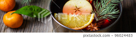 banner of tasty mulled wine hot drink with mandarin orange apple spices and christmas tree in pot banner of tasty mulled wine hot drink with mandarin orange apple spices and christmas tree in pot 96024483