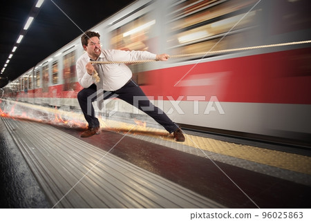 Businessman late to the metro 96025863