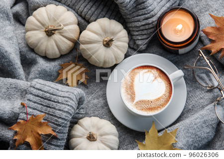 White pumpkins, coffee and autumn leaves White pumpkins, coffee and autumn leaves 96026306