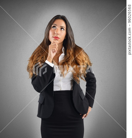 Reflective and thoughtful businesswoman 96026568