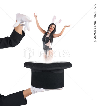 Woman bunny magically comes out of hat Woman bunny magically comes out of hat 96026572