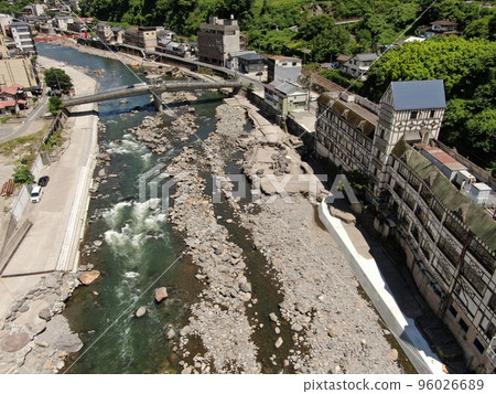 Aerial view of the Amanose hot spring town where restoration of the Kusu River from flood damage is urgent 96026689