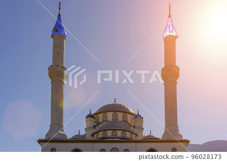 Architecture of the Islamic mosque in Turkey against the sunny blue sky. Byzantine style Muslim mosque. 96028173