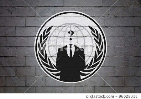Flag of the Anonymous on brick wall 96028315