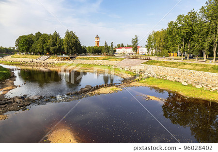View of the old water tower and the embankment of the river in Staraya Russa, Russia 96028402