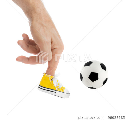 Hand with sport shoe and soccer football ball 96028685