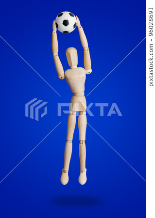 Football wooden toy figure on blue Football wooden toy figure on blue 96028691