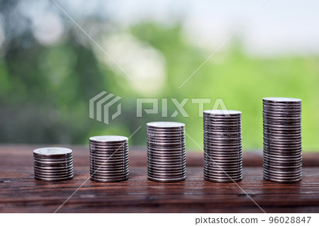 Stacks of coins as a concept for investing and saving Stacks of coins as a concept for investing and saving 96028847