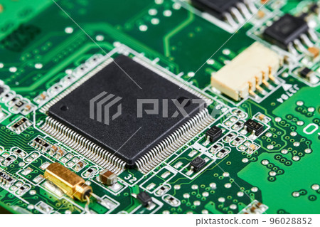 Close-up of computer chip on a part of electronic printed circuit board Close-up of computer chip on a part of electronic printed circuit board 96028852
