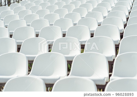 Seats of tribune on sport stadium. Concept of fans, chairs for audience, cultural environment concept. mpty seats, modern stadium. 96028893