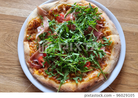 Fresh tasty pizza with meat and herbs. Fast food. Fresh tasty pizza with meat and herbs. Fast food. 96029105