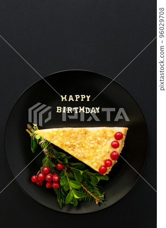 cake decorated Christmas tree branch and red berries, inscription happy birthday 96029708