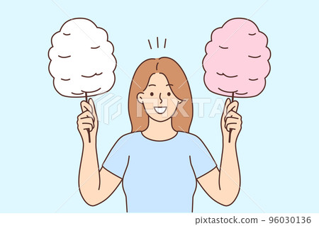 Smiling woman holding cotton candy Smiling woman holding cotton candy 96030136
