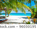 Maldive Islands Sand Beach and green palm foliage view 96030195