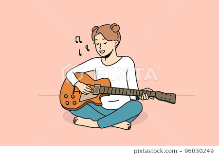 Smiling girl playing guitar 96030249