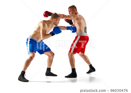 Unfocused effect portrait of two professional boxers boxing isolated on purple background in neon light. Concept of sport, competition, training, energy. 96030476