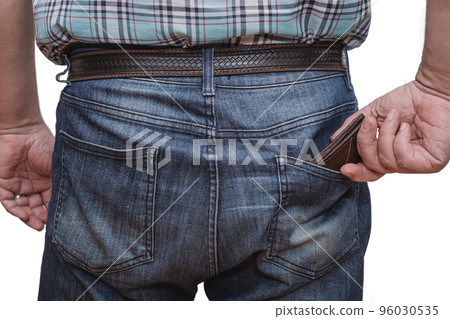 Close-up of a man's hand taking his documents out of the back pocket of a pair of jeans. Close-up of a man's hand taking his documents out of the back pocket of a pair of jeans. 96030535