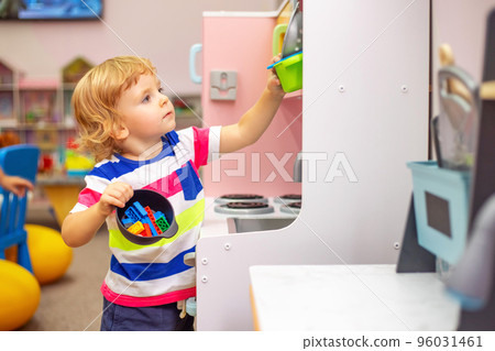 Child playing with colorful toys at the learning center or in kindergarten 96031461