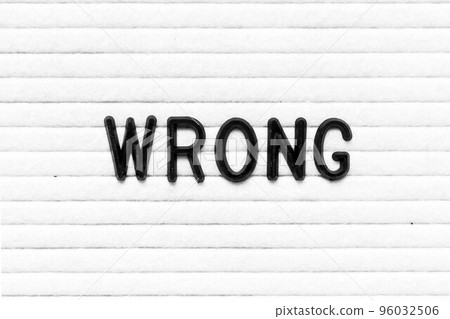 Black color letter in word wrong on white felt board background Black color letter in word wrong on white felt board background 96032506