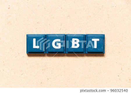 Tile letter in english word LGBT (Abbreviation of lesbian, gay, bisexual, and transgender) on wood background 96032540