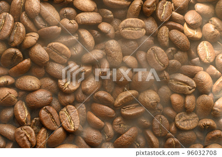 The texture of freshly roasted, ready-to-drink coffee, steam rising above the beans, black ava beans. The texture of freshly roasted, ready-to-drink coffee, steam rising above the beans, black ava beans. 96032708