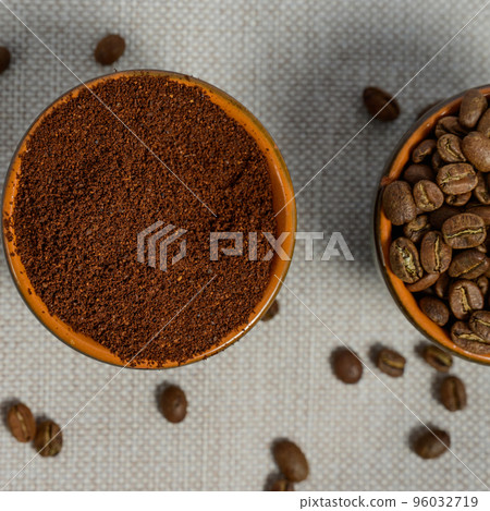 coffee beans, ground coffee in cups on a linen background 96032719