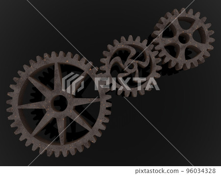 Three metal gears connected to each other on an asphalt background Three metal gears connected to each other on an asphalt background 96034328