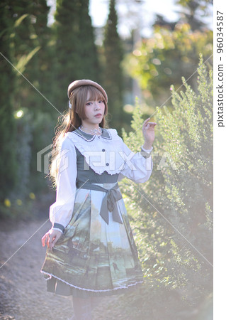 A beautiful woman in lolita dress in garden background Japanese street fashion portrait A beautiful woman in lolita dress in garden background Japanese street fashion portrait 96034587