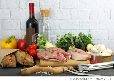 Concept of cooking on dark wooden table, cooking meat 96037095