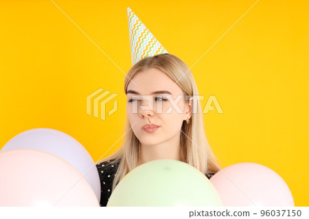 Concept of Happy Birthday with attractive girl on yellow background 96037150
