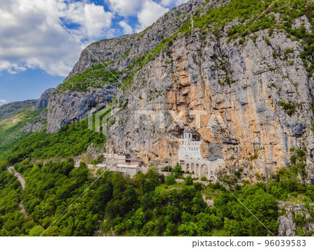 Monastery of Ostrog, Serbian Orthodox Church situated against a vertical background, high up in the large rock of Ostroska Greda, Montenegro. Dedicated to Saint Basil of Ostrog Monastery of Ostrog, Serbian Orthodox Church situated against a vertical background, high up in the large rock of Ostroska Greda, Montenegro. Dedicated to Saint Basil of Ostrog 96039583
