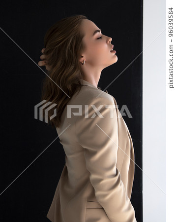 Elegant style. A beautiful fashion model poses in Elegant style. A beautiful fashion model poses in 96039584