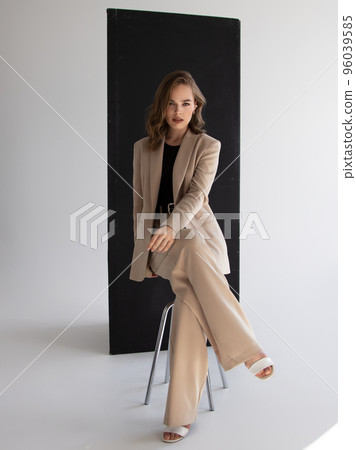 Elegant style. A beautiful fashion model poses in Elegant style. A beautiful fashion model poses in 96039585