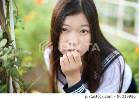 school girl costume at park outdoor with flowers garden background 96039980