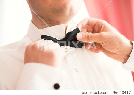 Beautiful man, groom posing and preparing for wedding 96040417