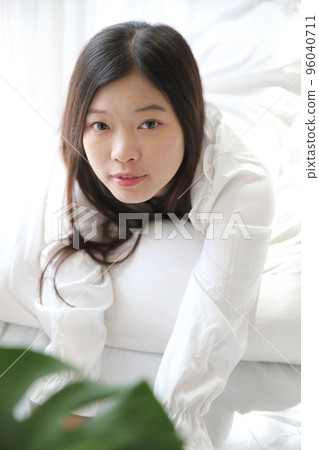 girl sleeping with pillow at white bedroom girl sleeping with pillow at white bedroom 96040711