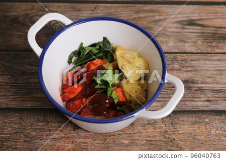 Shrimp dumpling with roasted pork on wood background Shrimp dumpling with roasted pork on wood background 96040763