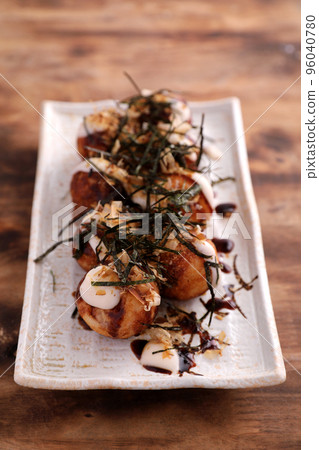 Takoyaki isolated in wood background Japanese food Takoyaki isolated in wood background Japanese food 96040780
