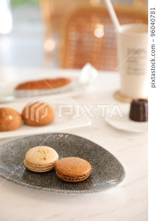 brown macaron dessert in coffee shop background brown macaron dessert in coffee shop background 96040781