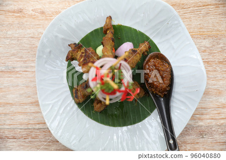 Chicken Satay on dark brown table street food appetizer Chicken Satay on dark brown table street food appetizer 96040880