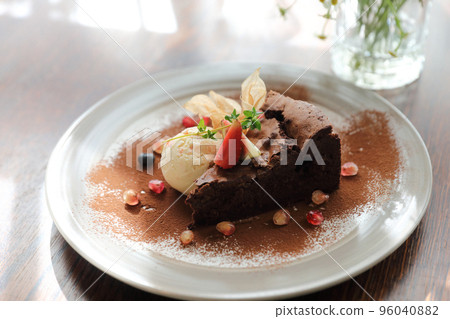 Chocolate cake with ice cream dessert on wood table Chocolate cake with ice cream dessert on wood table 96040882