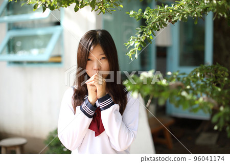 Japanese school girl in local coffee shop Japanese school girl in local coffee shop 96041174