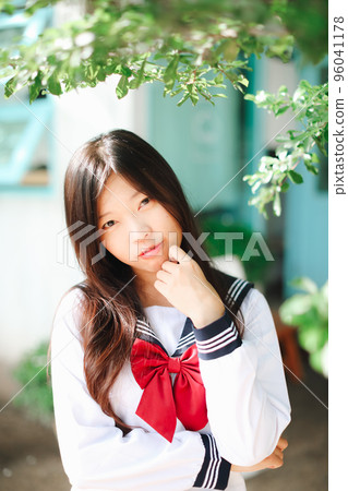 Japanese school girl in local coffee shop Japanese school girl in local coffee shop 96041178