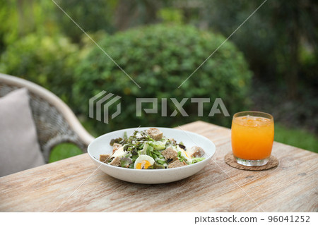 caesar salad appetizer on wooden background 96041252